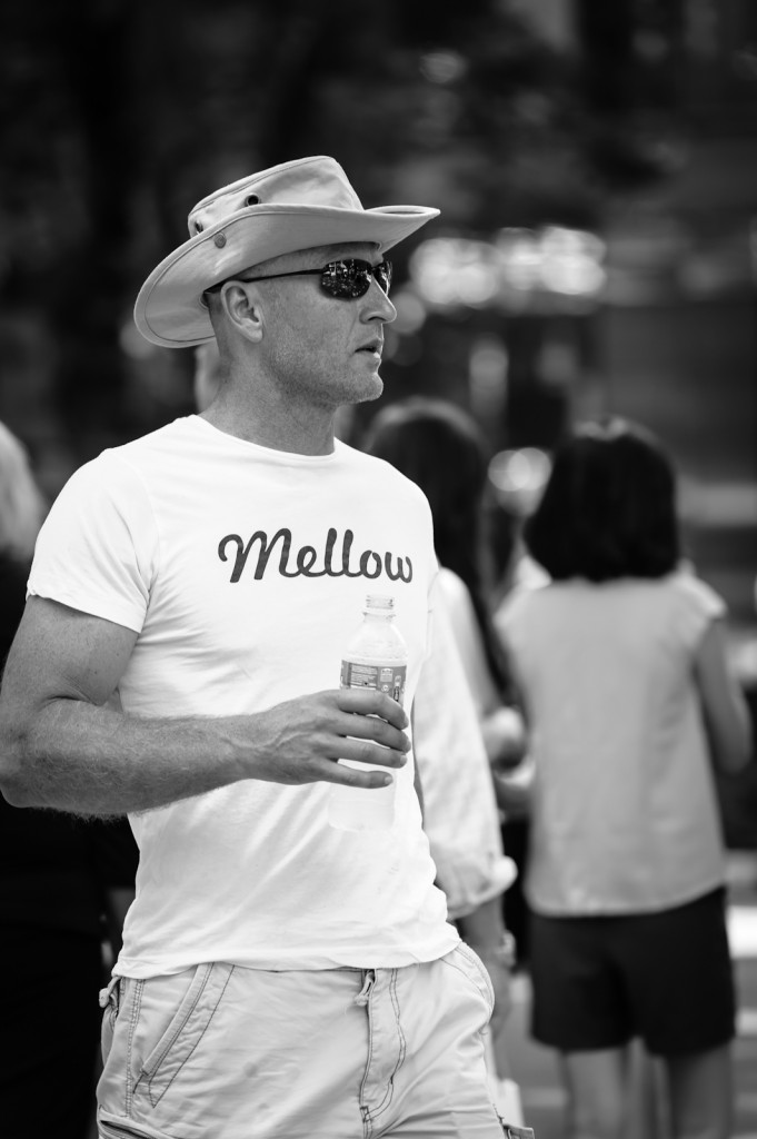 Street photography - Man with cowboy hat wearing a Mellow t-shirt