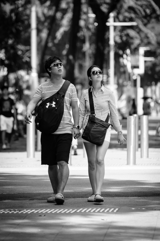 Street photography - Matching couple looking upwards