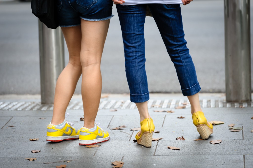 Street photography - denim bottoms and yellow shoes