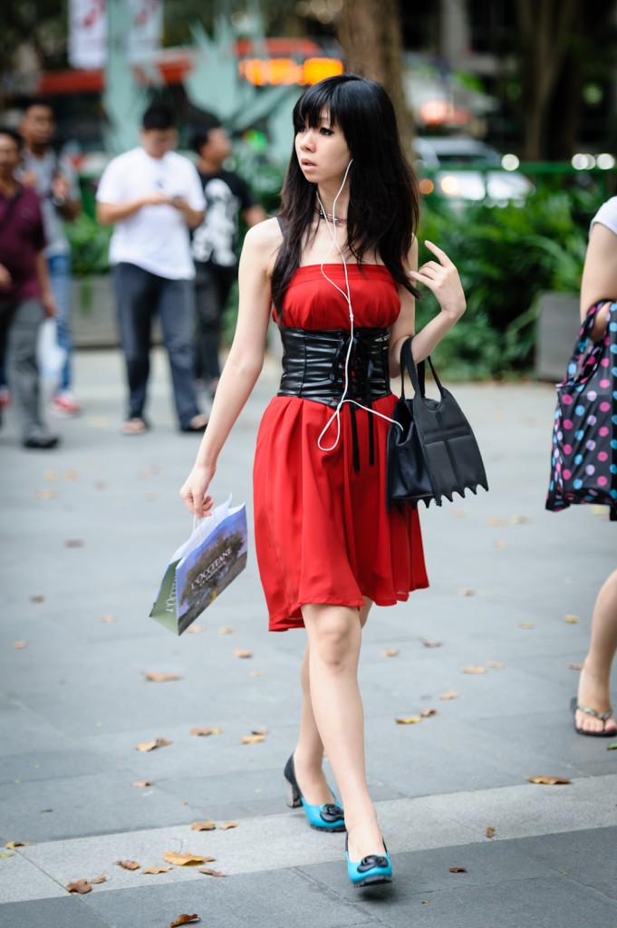 Street photography - girl in red dress and blue shoes