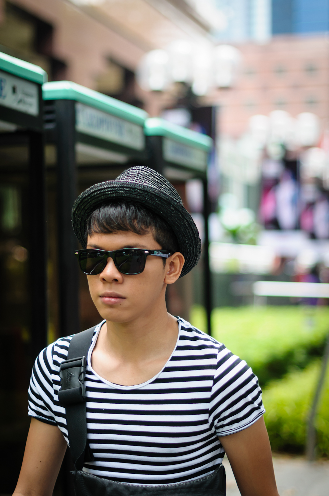 Street photography - man with a hat wearing shades and stripes