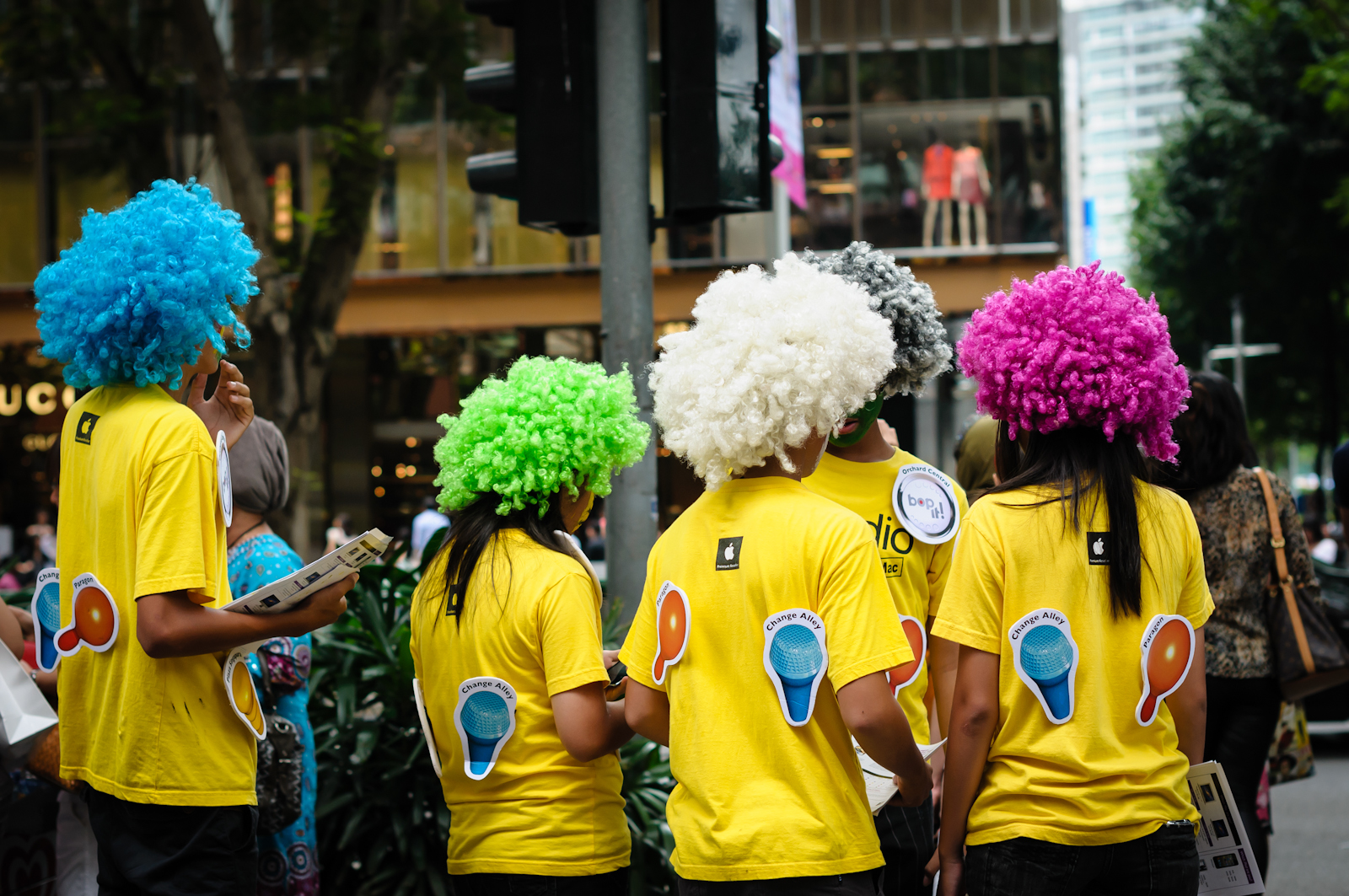 Street photography - iStudio staff in colourful afro wigs