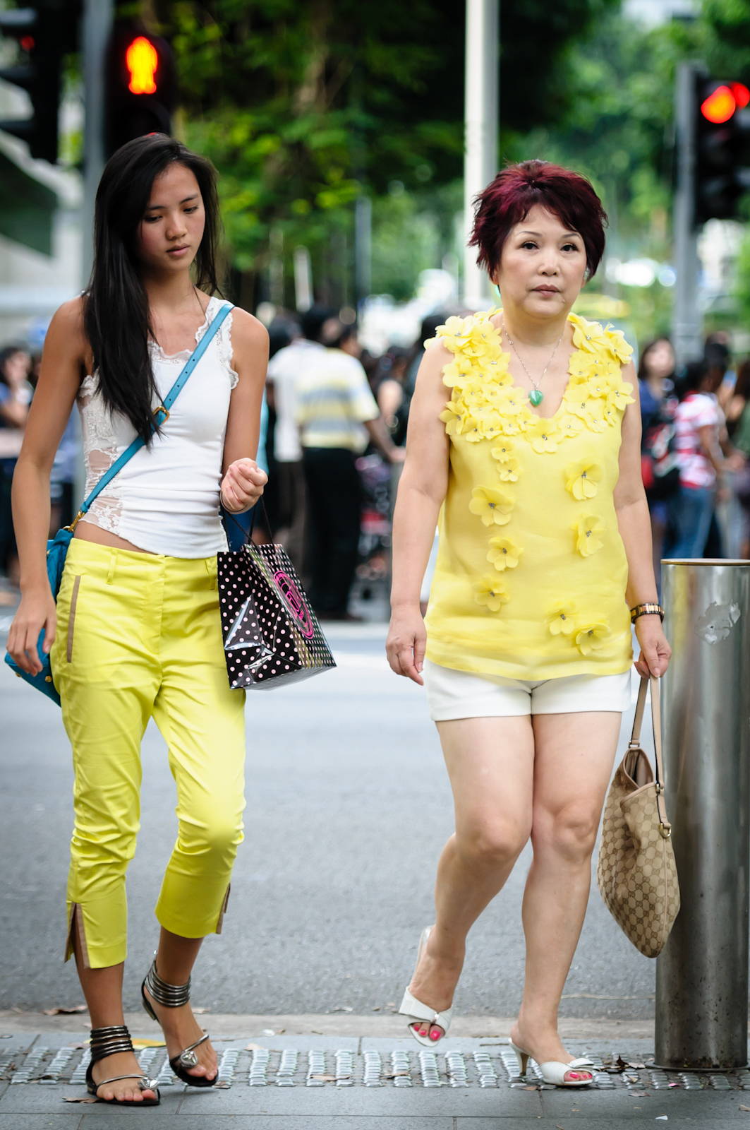 Street photography - Mother and daughter wearing yellow and white