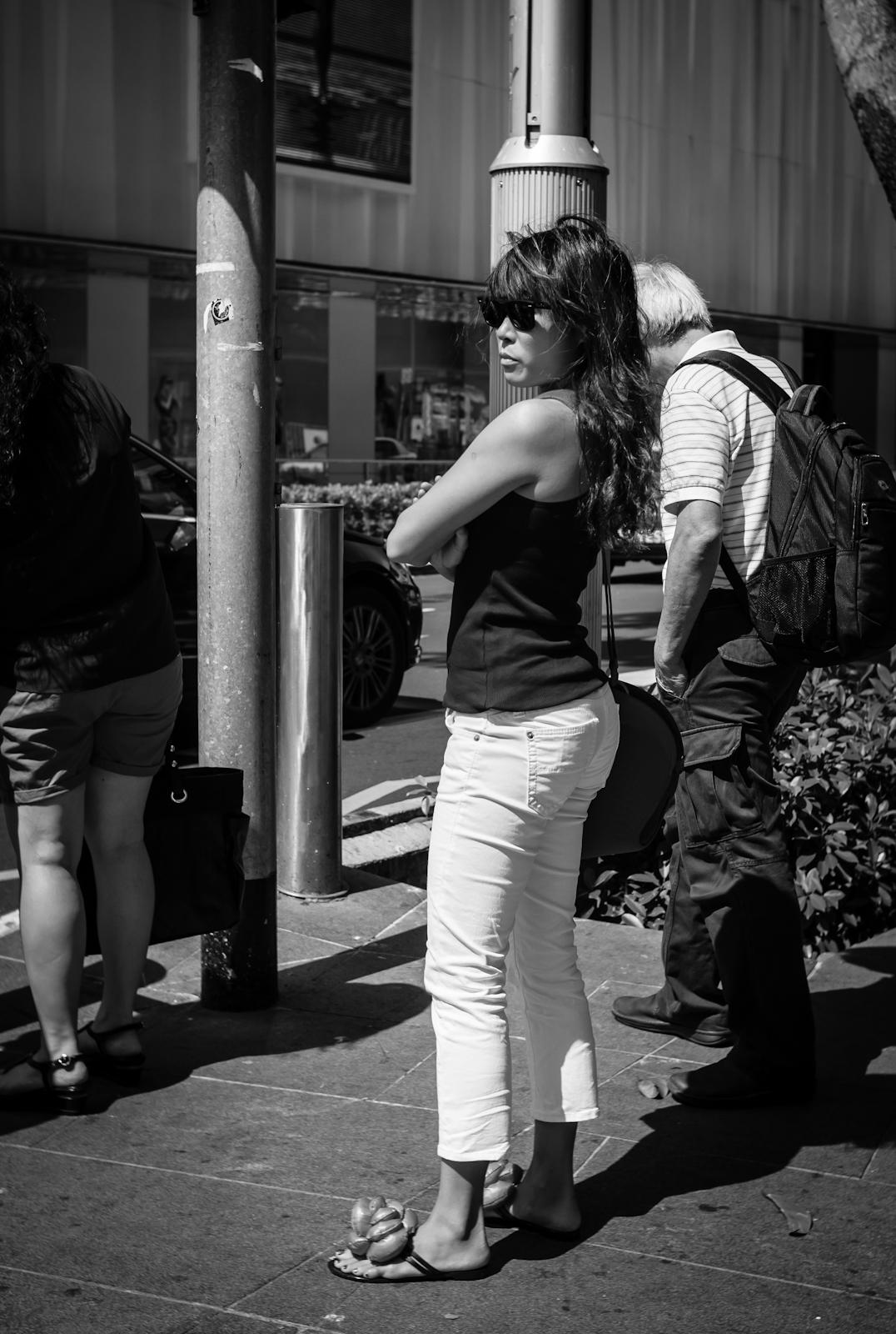 Street photography - woman wearing slippers with big flower