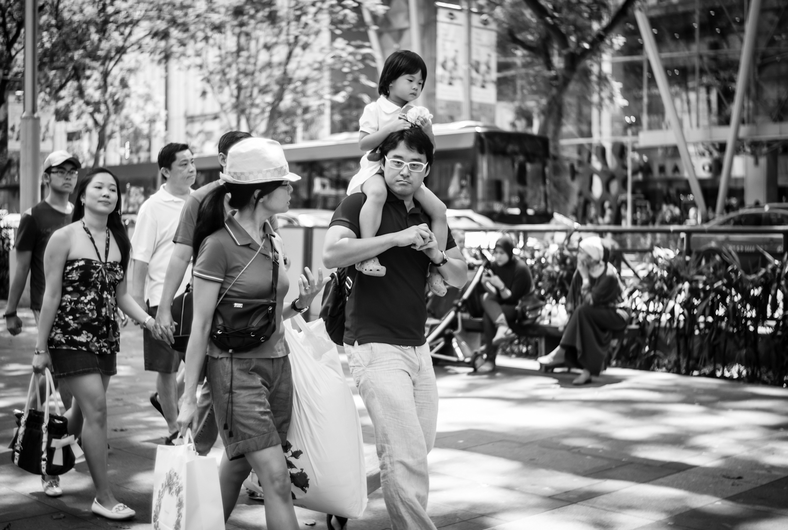 Street photography - family walking along Orchard Road