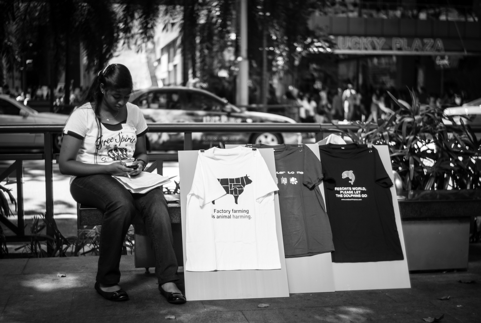 Street photography - girl promoting the green movement in Orchard Road