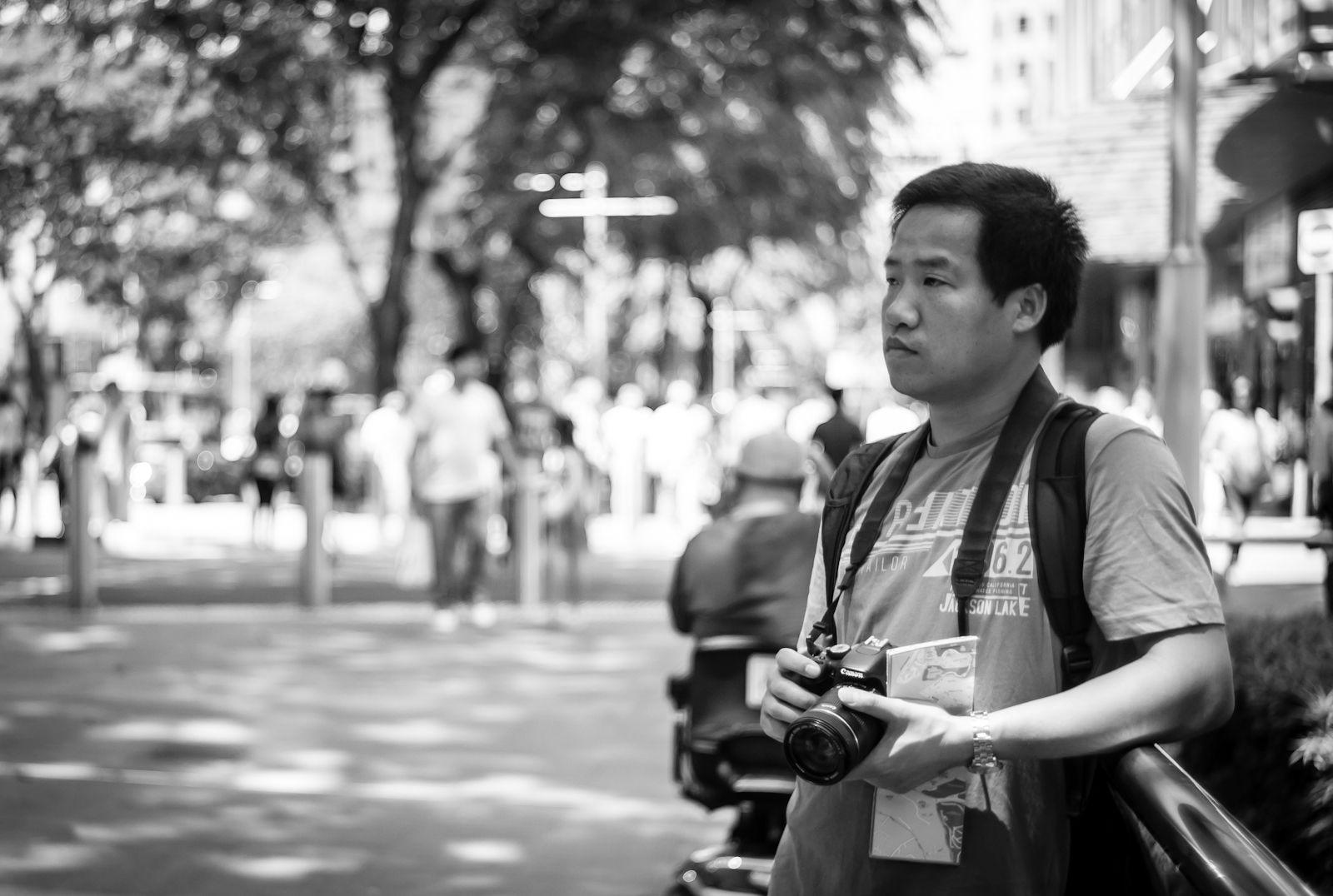 Street photography - tourist photographing in Orchard Road