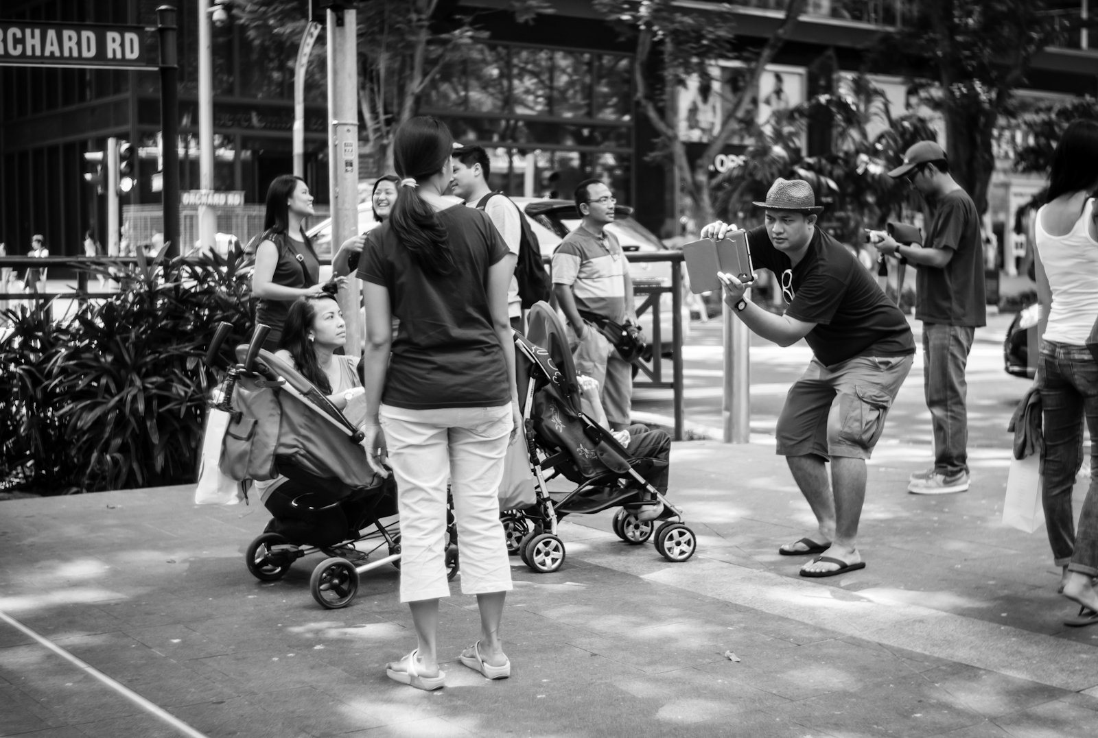 Street photography - Tourist taking photos with a tablet