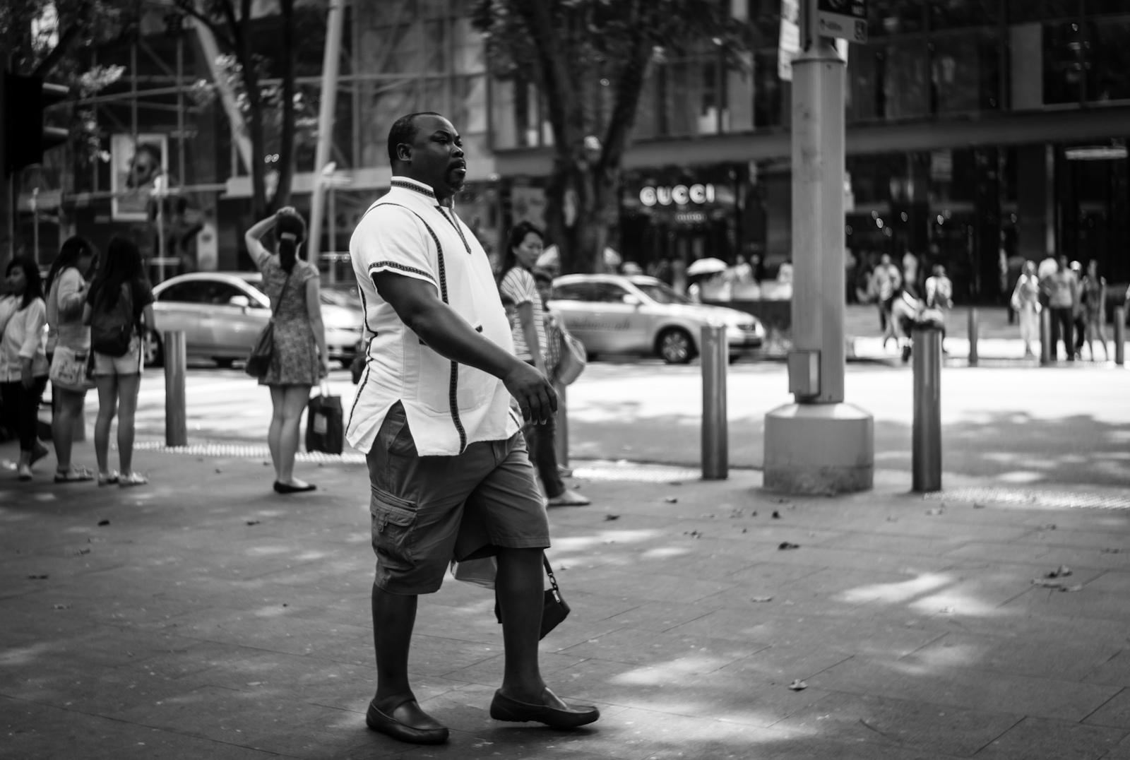 Street photography - Man walking along Orchard Road