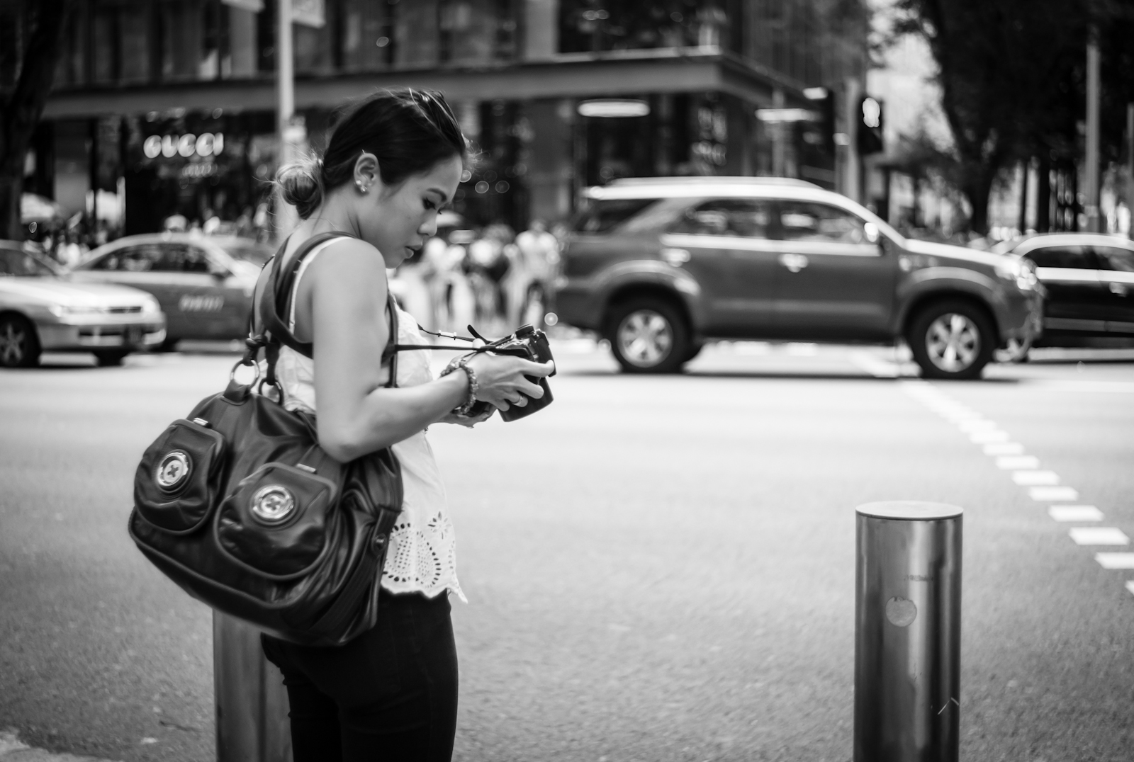 Street photography - Woman with a DSLR camera