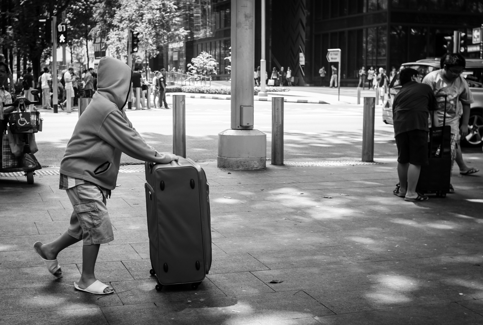 Tourist pushing a large suitcase