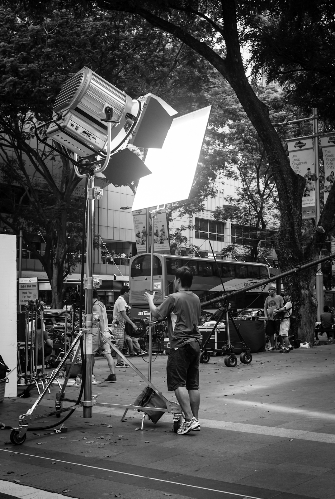 Crew setting up lighting for a fashion runway along Orchard Road