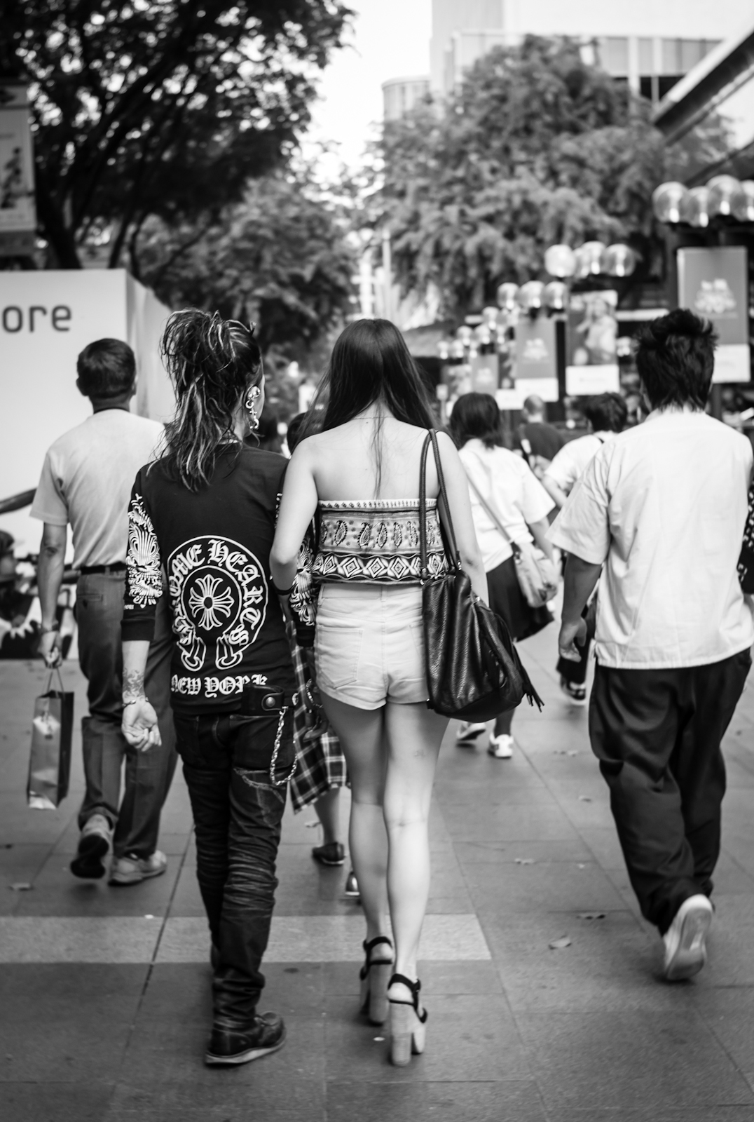 Couple in trendy fashion along Orchard Road