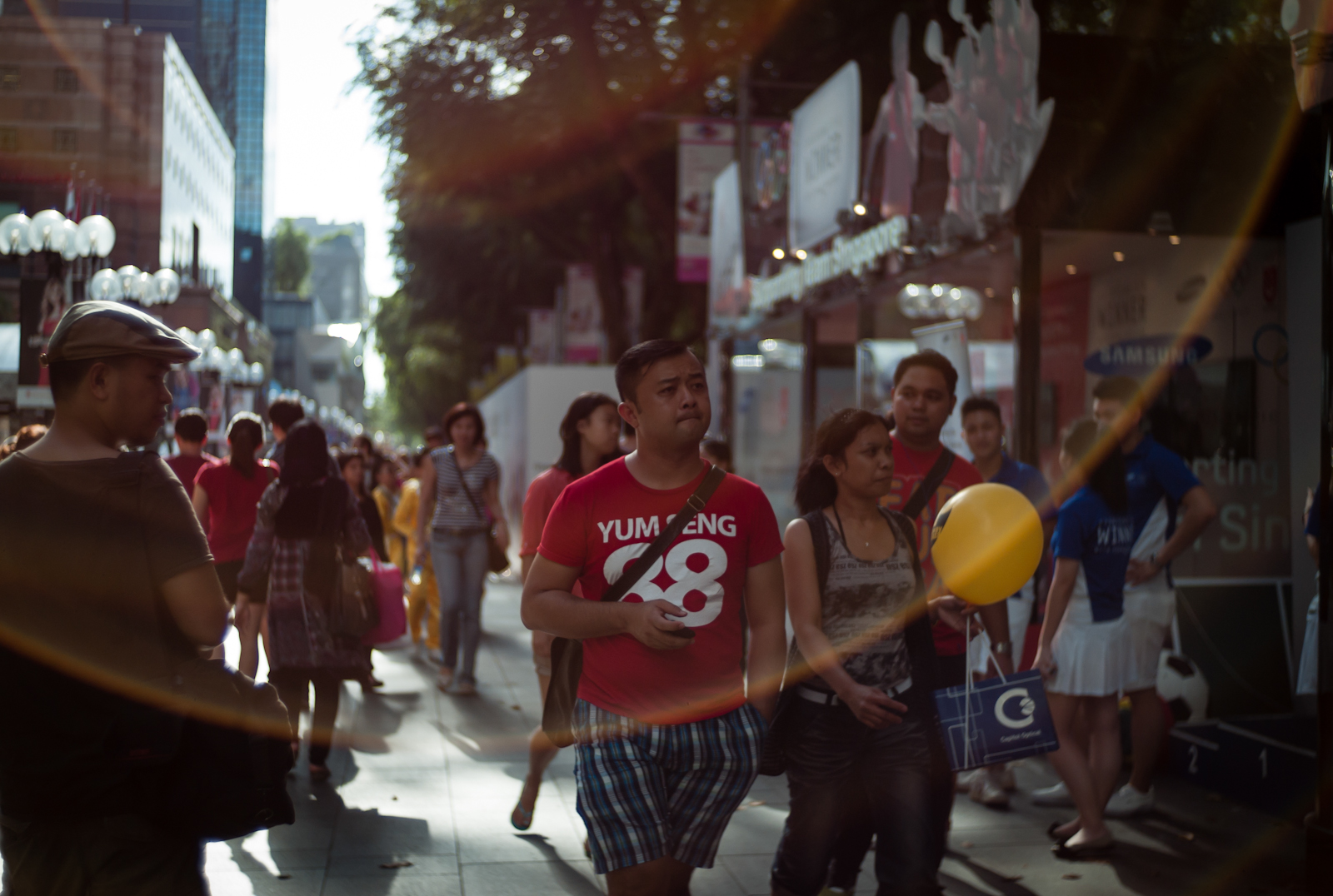 Street scene in Orchard Road with a large lens flare