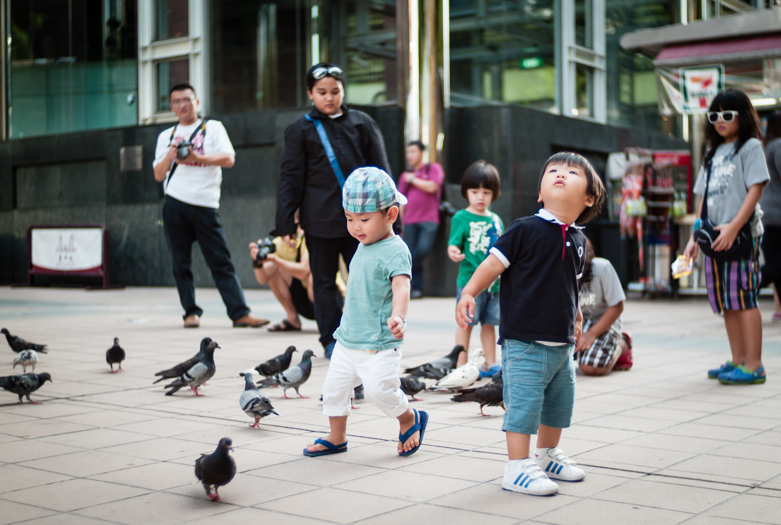 Children chasing pigeons in Orchard Road