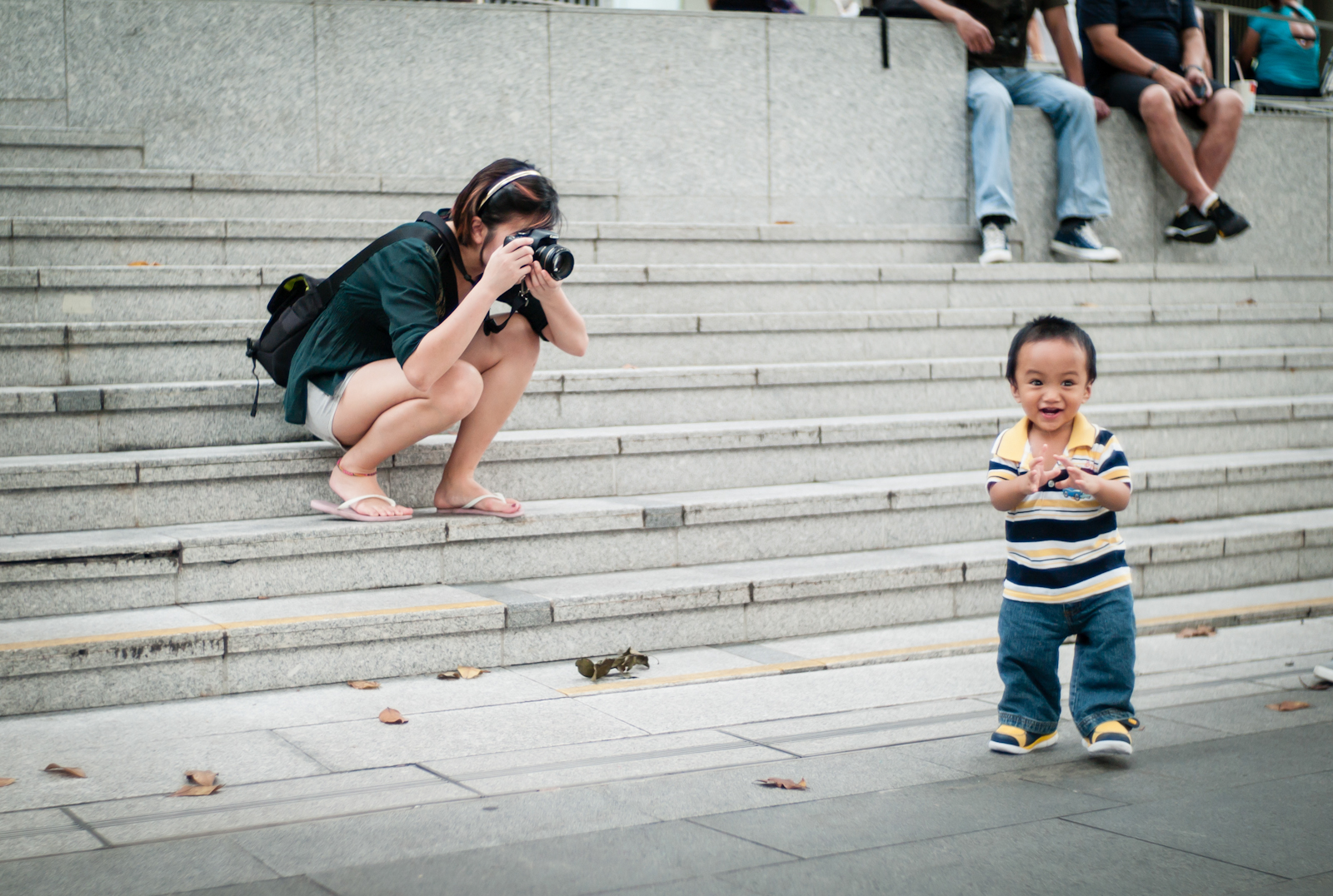 Photographer taking photos of a child