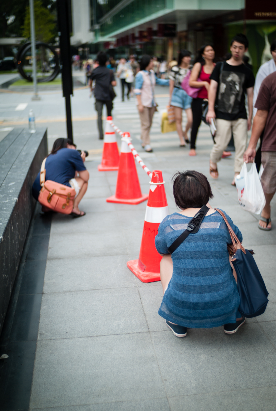 Two photographers shooting cones in Orchard Road